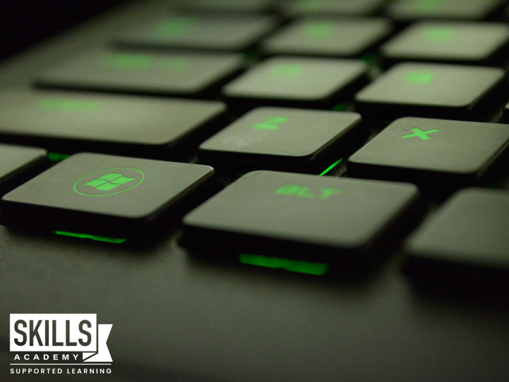 A computer zoomed in on the keyboard, with the Windows key as the focus. Study our MTA Fundamentals Courses today
