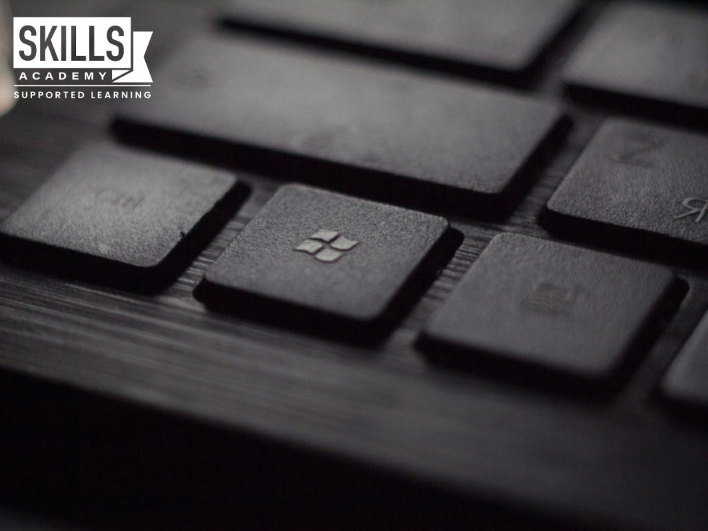 A laptop keyboard with a button that has a microsoft icon. Studying Microsoft Windows Courses will make you an expert in operating computer systems.