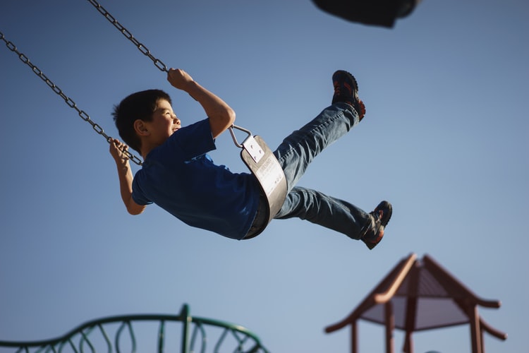 Kid at playground - Explore Childcare Careers