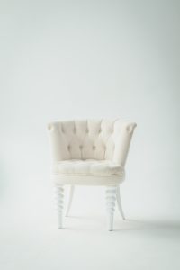 Furniture designer displaying a chair.