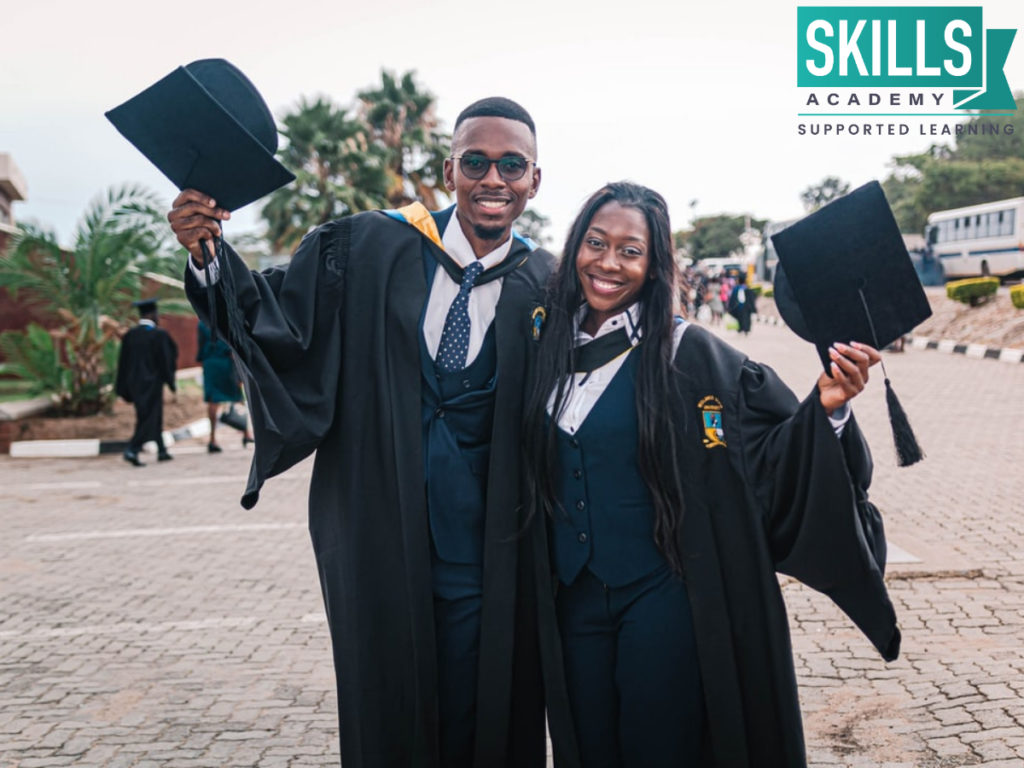 Two students graduating. Get a Matric and pursue your study goals.