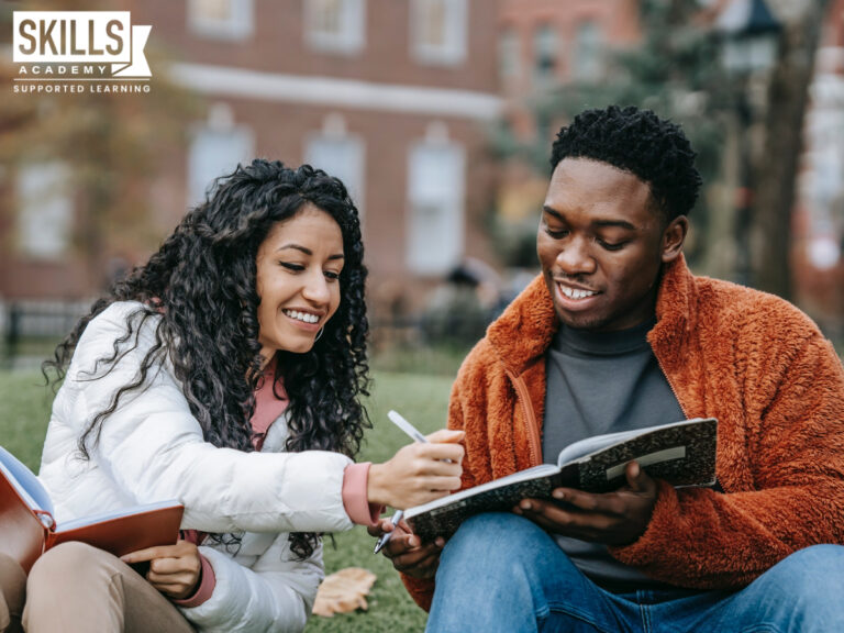 Two students sitting outside helping each other with their studies. Take a look at our policies right here.