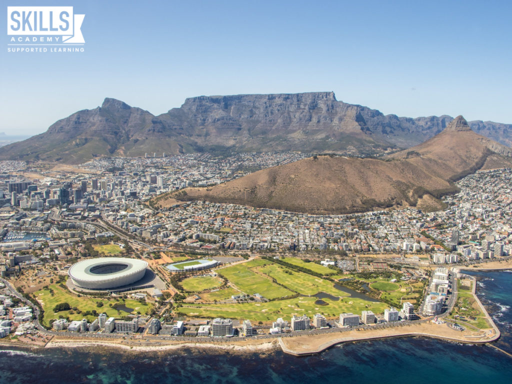 An aerial view of Cape Town and Table Mountain. Start a career in Tourism with our Tourism and Guest House Management Courses.
