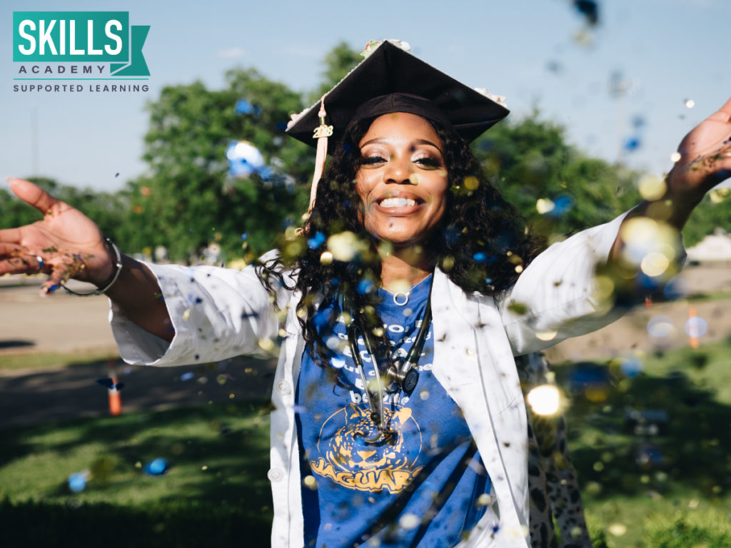 Woman smiling wearing a graduation cap. No need to ask "What can I Study With a Diploma Pass?". Find out everything right here.