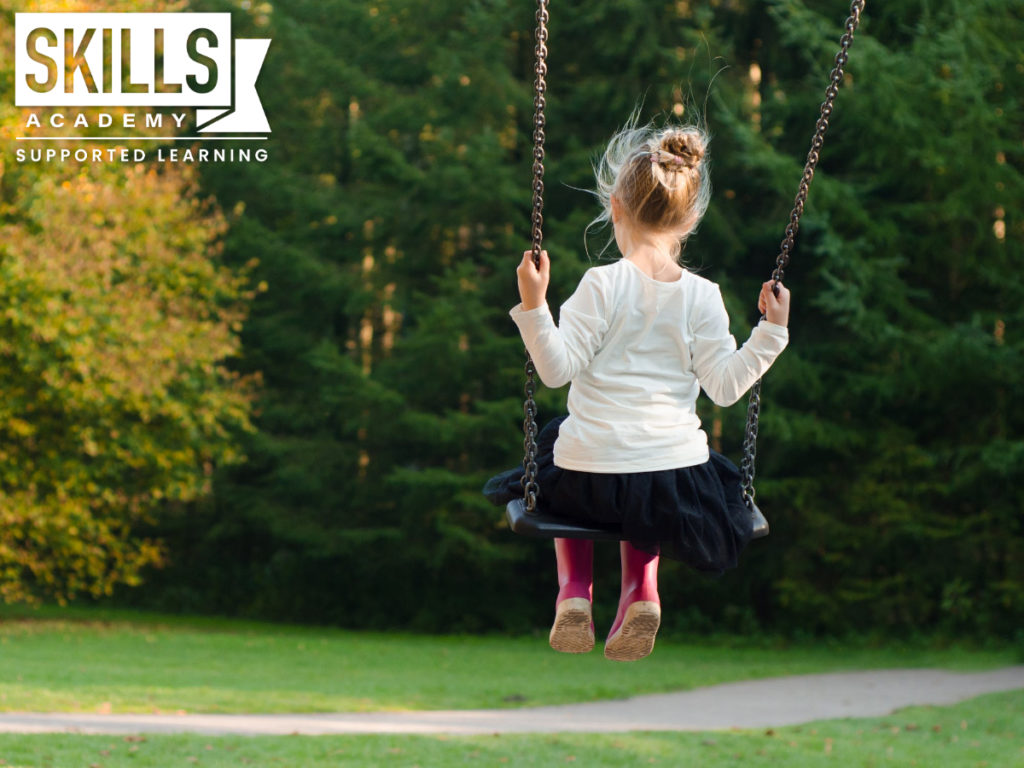 Little girl on swing at educare centre. What is educare? Here is all you need to know