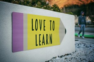 Love to Learn banner written on a street wall