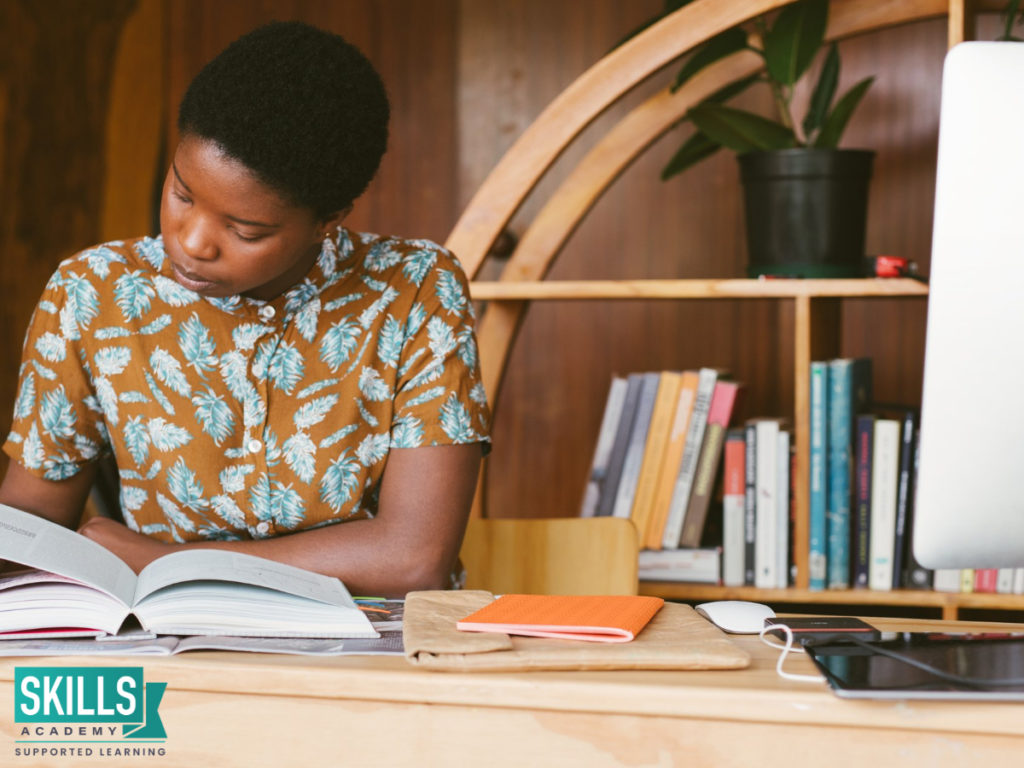 A young woman reading a book. Upskilling Yourself is the key to Get a Job. Enrol for Our Courses Today.