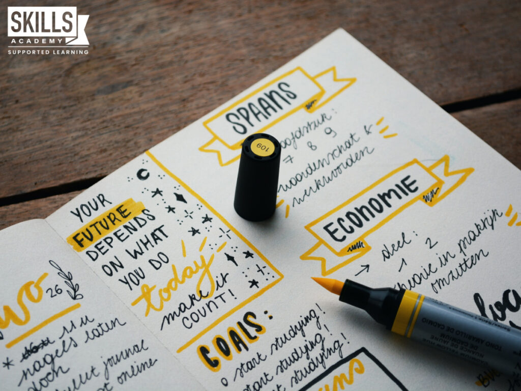 Notebook with yellow marker. Learn how to change careers with us.