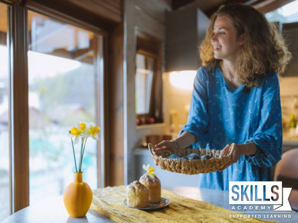 A woman decorating cake in her home. Are you a good baker? Why not start an Online Business selling beautiful cakes!