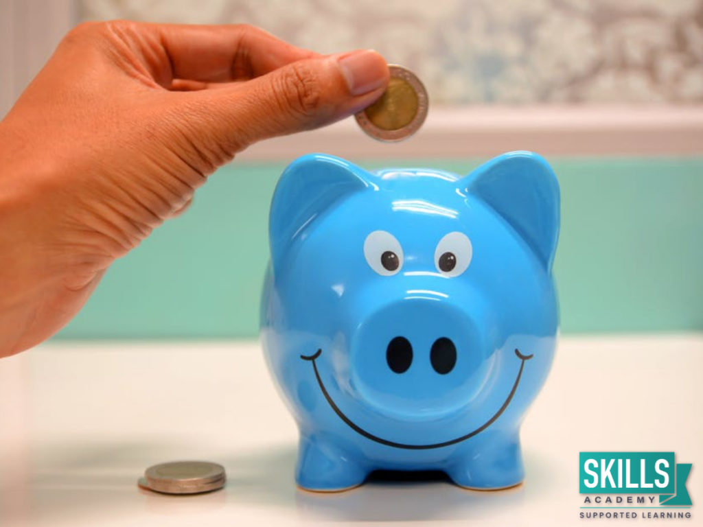 A blue piggy bank with a coin. Looking for tips on How to Increase Your Salary? Enrol into our courses and update your skills.