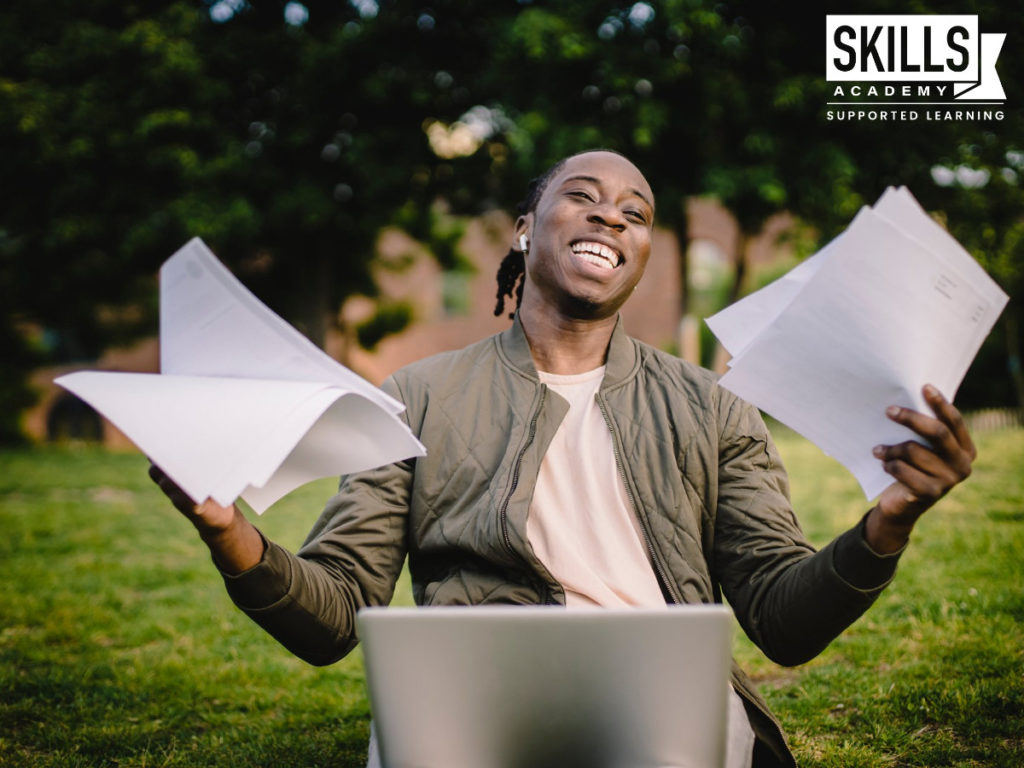 A happy male student who finally figured out How to get the Most out of an HR Course