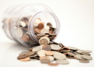 A jar with coins. Learn how to Increase Your Salary with these tips.