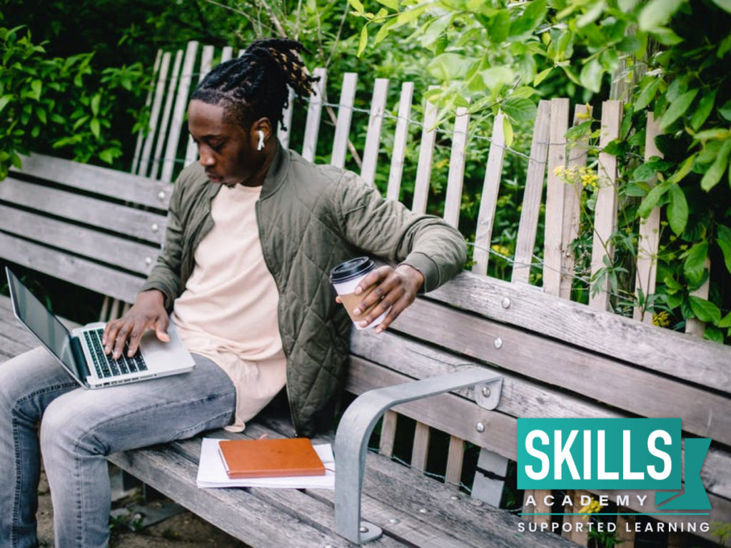 A student sitting on a bench revising his work. Get your Civil Technology Matric Past Papers right here!