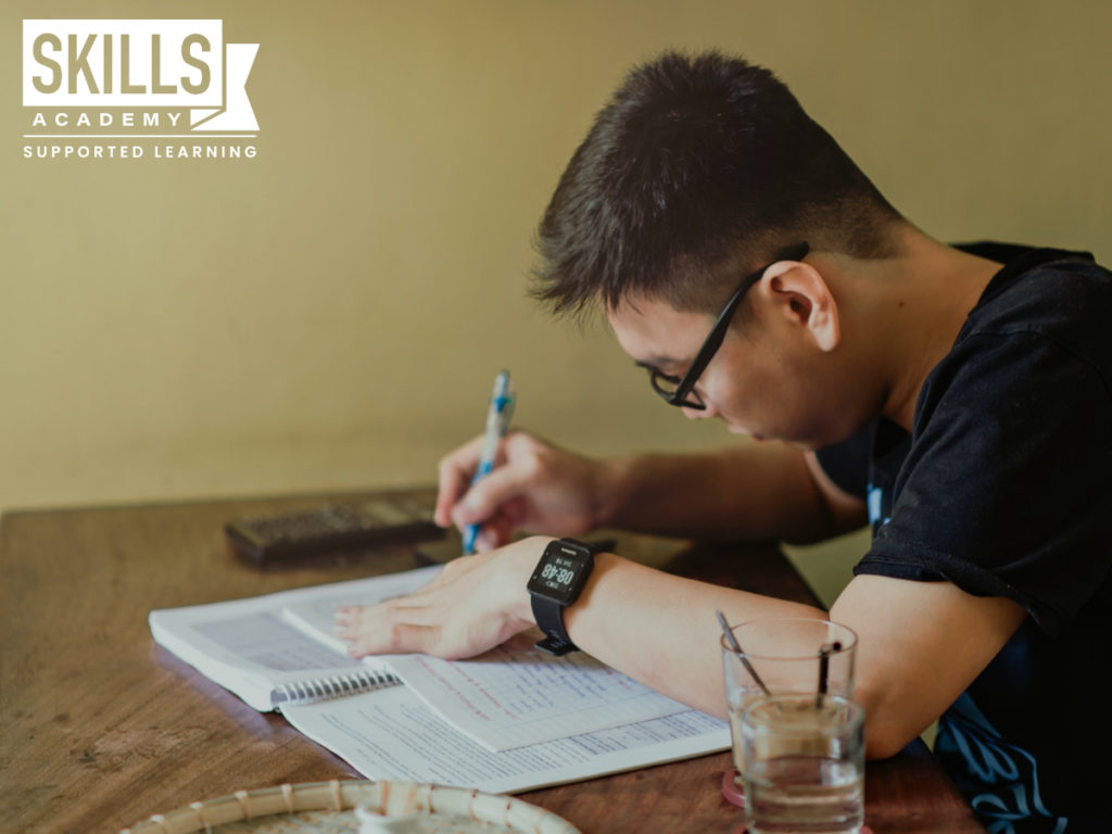 Student making notes and studying for his matric exam. Wondering What I can do to Pass my Matric? Find out everything and more right here.
