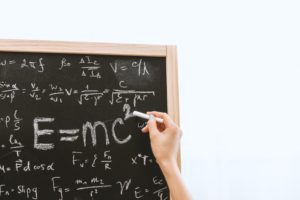 Science equation on a black board. Know your formula. Physical Sciences Matric Past Papers will help you pass your exams.