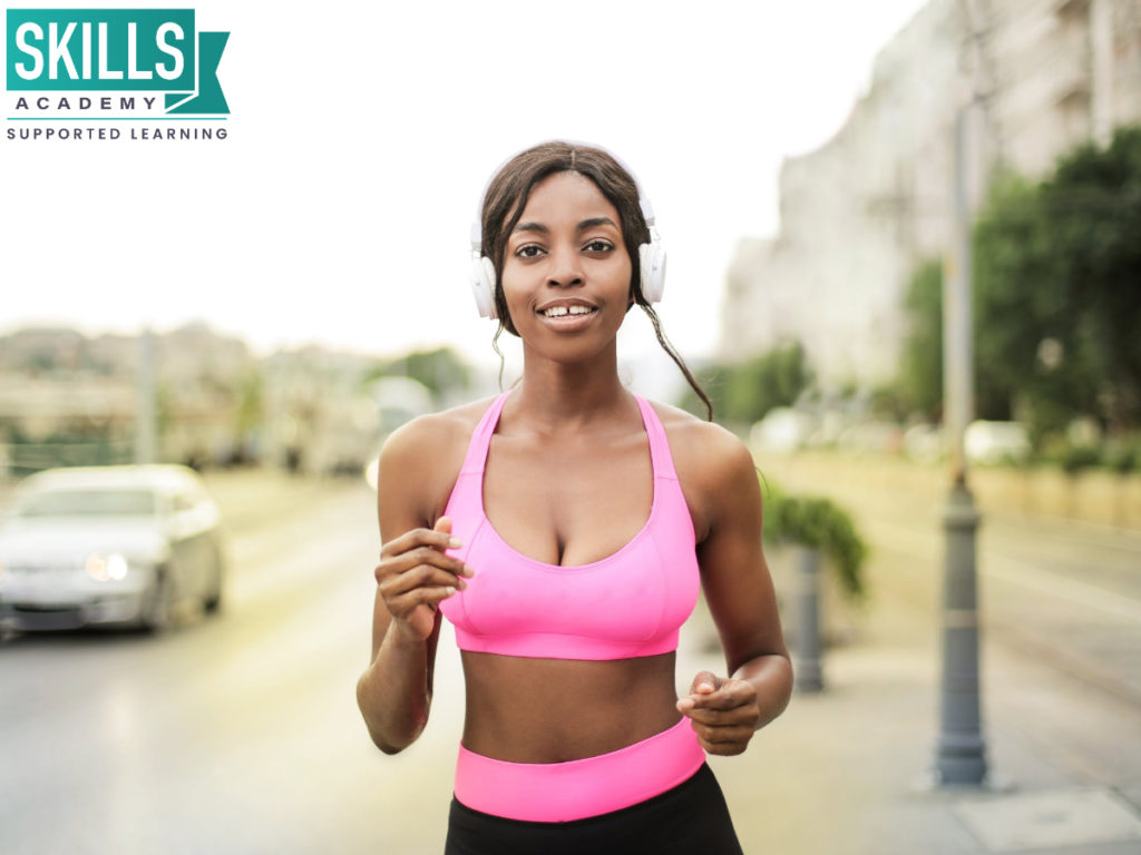 Woman running and keeping fit. Exercising is one of the many ways How to Cope With Year End Fatigue