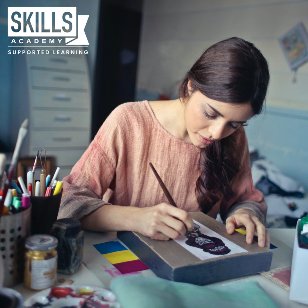 An artist in her studio using Learning Techniques for Creative Minds