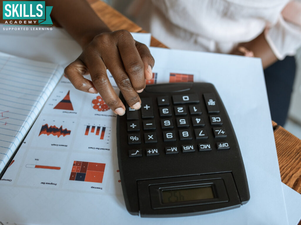 Bookkeeper doing calculations on a calculator. Take a look at all the great things in store for you in the ICB Prospectus 2022.
