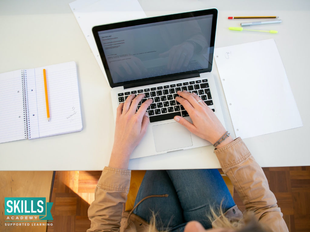 Matriculant sitting at a desk studying for her supplementary exam using our tips on how to prepare for your matric exam. Learn How to Apply for Supplementary Exams and ace your second chance.