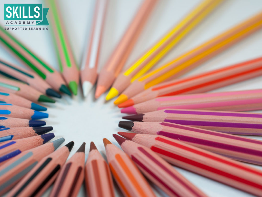 Pencil crayons in a circle on a white surface. Learn How to Start a Creche at Home and more right here.