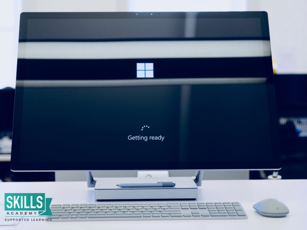 Windows logo on a desktop computer. Microsoft Office: Basic Skills Towards a Successful Career.