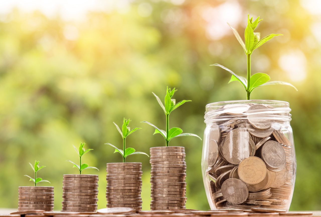 Coins and pennies in jars. Watch how money grows with our courses. Our Wealth Management NQF 5 Course Breakdown will give you insight on our courses