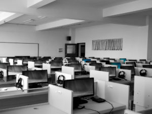 A call center with desks, computers and telephones. Everything you Need to Know About a Call Center Career.