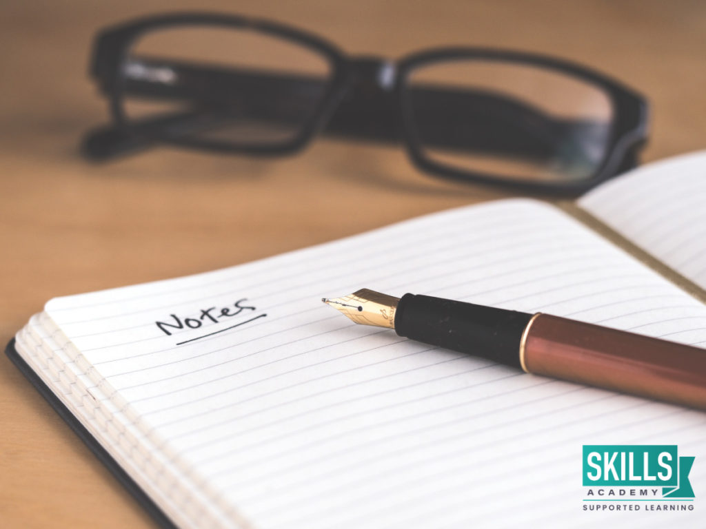 Pen on top of an open notebook next to reading glasses. Learn more on the 9 useful tips on how to make notes right here.