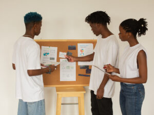 Group of student giving a presentation during class. Take a look at our tips on giving a great presentation.