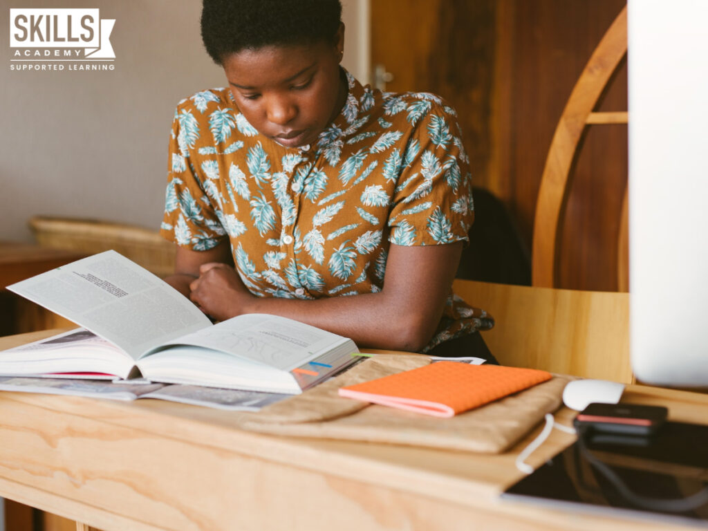 Student reading through her textbook while studying for an exam. Do you need matric to study distance learning? Find out right here.