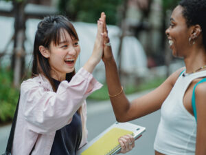 Matriculants congratulating each other on passing matric. Find out where to get your matric results here.