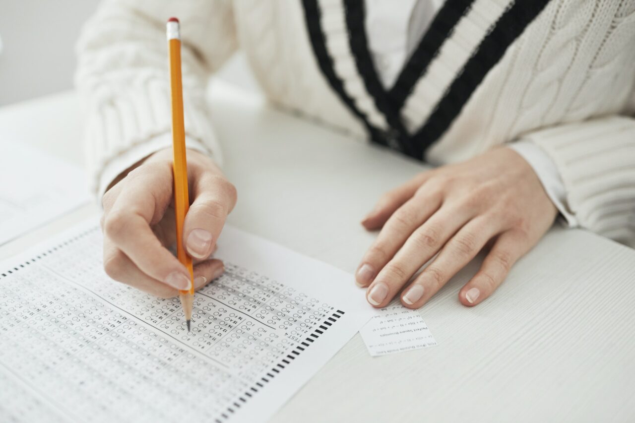 A student completing an exam before finding out how to deal with poor matric exam results. Study our courses today!