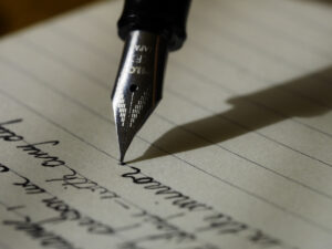 Pen on a notepad. Tips on how to write a motivational letter