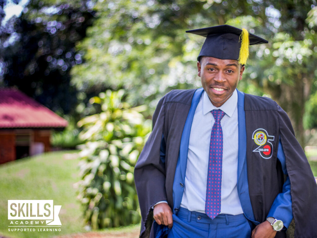 Graduate standing on grass. Short Courses That are in Demand in South Africa 2022