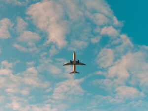 Plane flying in the sky. Tips for Finding a job Overseas