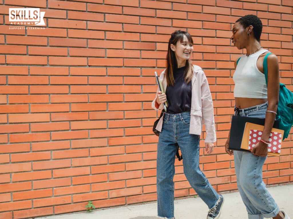 Two girls talking and walking. What to Avoid When Choosing a Course