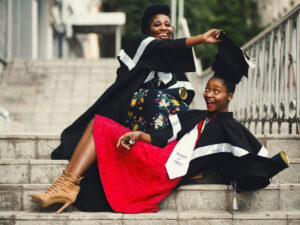 Two graduate girls on the stairs. Tips to Help Students Prepare for Their Careers