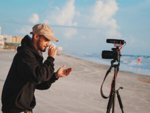 Guy talking to camera on the beach. What to Include in Your Video Cover Letter.