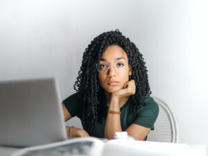 Girl sitting behind her laptop. Courses That Will Help you get an Entry-level job