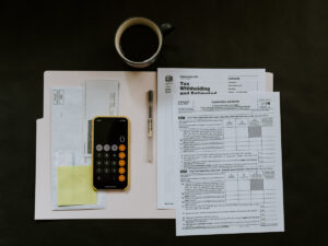 Calculator and tax papers. Study ICB Accounting Part-Time