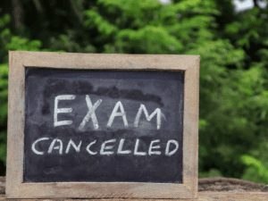 chalk board written Exam cancelled. ICB Exam Cancellation